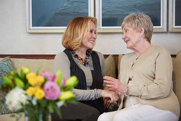 Two older women on a couch